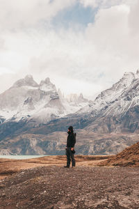 Man standing against mountains