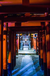 Empty long pathway along pillars