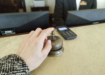 High angle view of man using smart phone on table