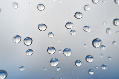 Close-up of water drops on glass