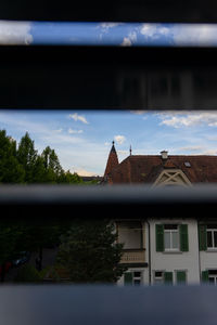 House by building against sky