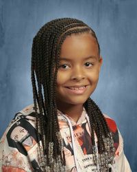 Aspiring south american child actress, posing for her first school's picture day.