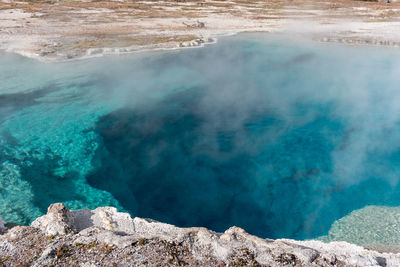 Brilliant blue thermal pool in yellowstone national park