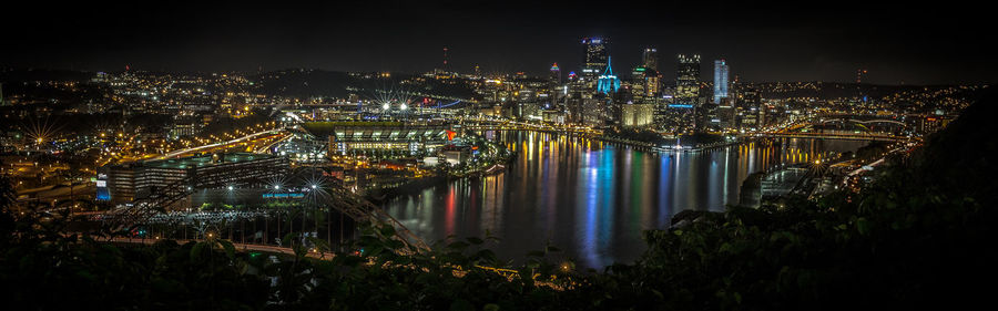 High angle view of illuminated city buildings at night