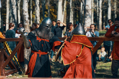 Rear view of people in the forest