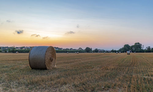 Rural village with straw bales at sunset on the mediterranean coast