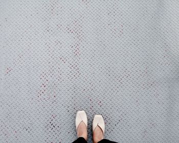 Low section of woman standing on floor