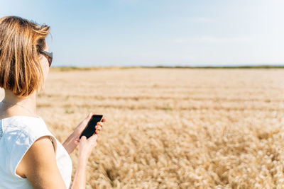 Summer concept, caucasian middle-aged woman in the countryside