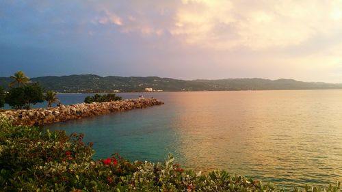 Scenic view of sea against cloudy sky