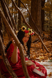 Portrait of young woman in forest