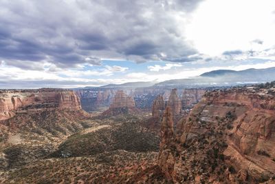 Aerial view of landscape against cloudy sky