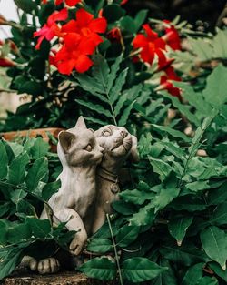 Close-up of statue against plants in garden