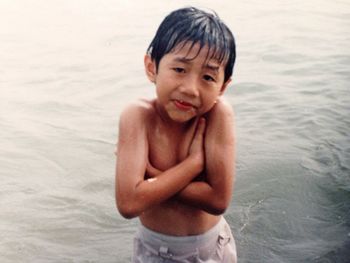 Portrait of baby boy in water