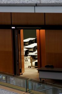 Empty chairs and table in building