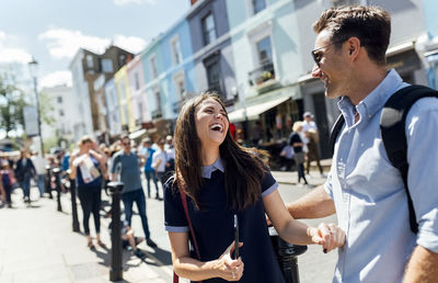 Uk, london, portobello road, couple having fun