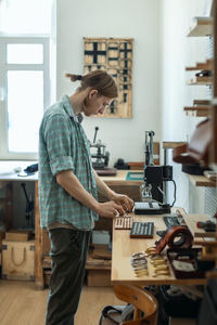 Side view of woman working