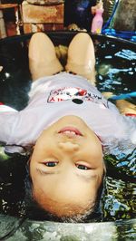 High angle view of boy swimming in pool