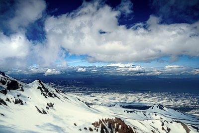Scenic view of snowcapped mountains against sky