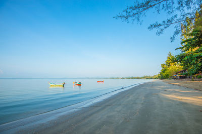 Scenic view of sea against clear blue sky