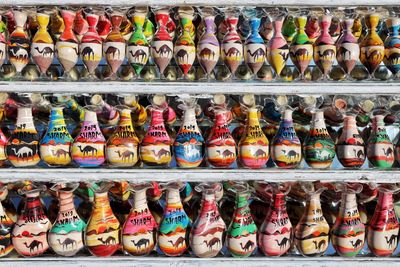 Multi colored shoes for sale at market stall