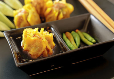 High angle view of dumplings in container