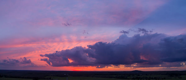 Scenic view of dramatic sky during sunset