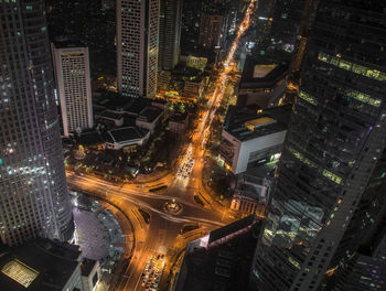 High angle view of illuminated buildings in city at night