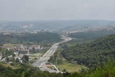 High angle view of trees and buildings against sky