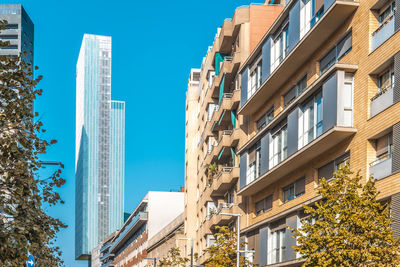 Low angle view of skyscrapers against clear sky