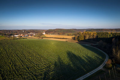 Scenic view of agricultural field against sky