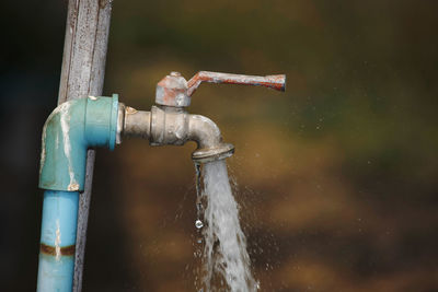 Close-up of water flowing from pipe