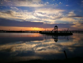 Reflection of clouds in water at sunset