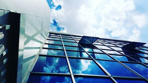 Low angle view of building against cloudy sky