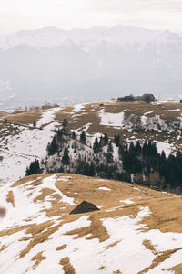 Scenic view of lake by mountains against sky