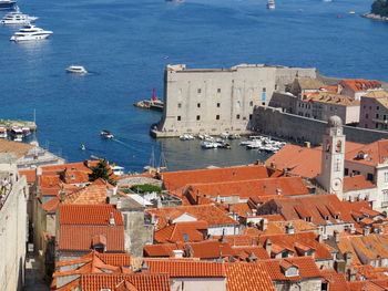 High angle view of townscape by sea