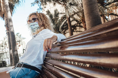 Low angle view of woman wearing sunglasses