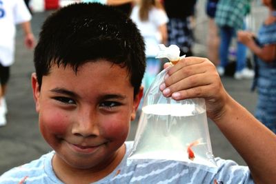 Close-up portrait of boy holding ice cream