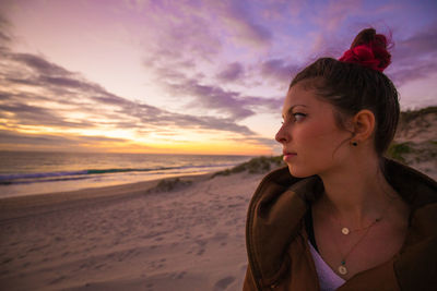 People on beach at sunset