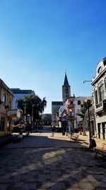 City street against clear blue sky