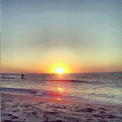 Scenic view of sea at sunset