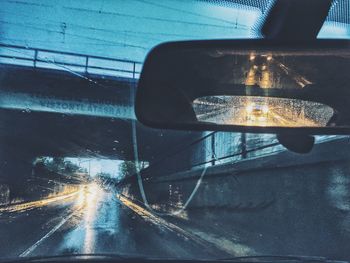 Close-up of illuminated car on road