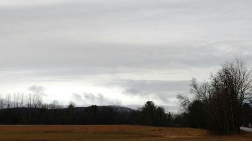 Scenic view of landscape against cloudy sky