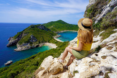 Travel in greece. female hiker girl enjoying natural landscape in corfu island, greece.