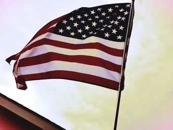 Low angle view of flag against sky