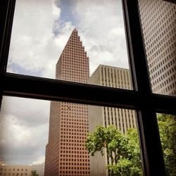 Low angle view of building against cloudy sky