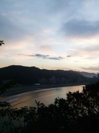 Scenic view of mountains against cloudy sky