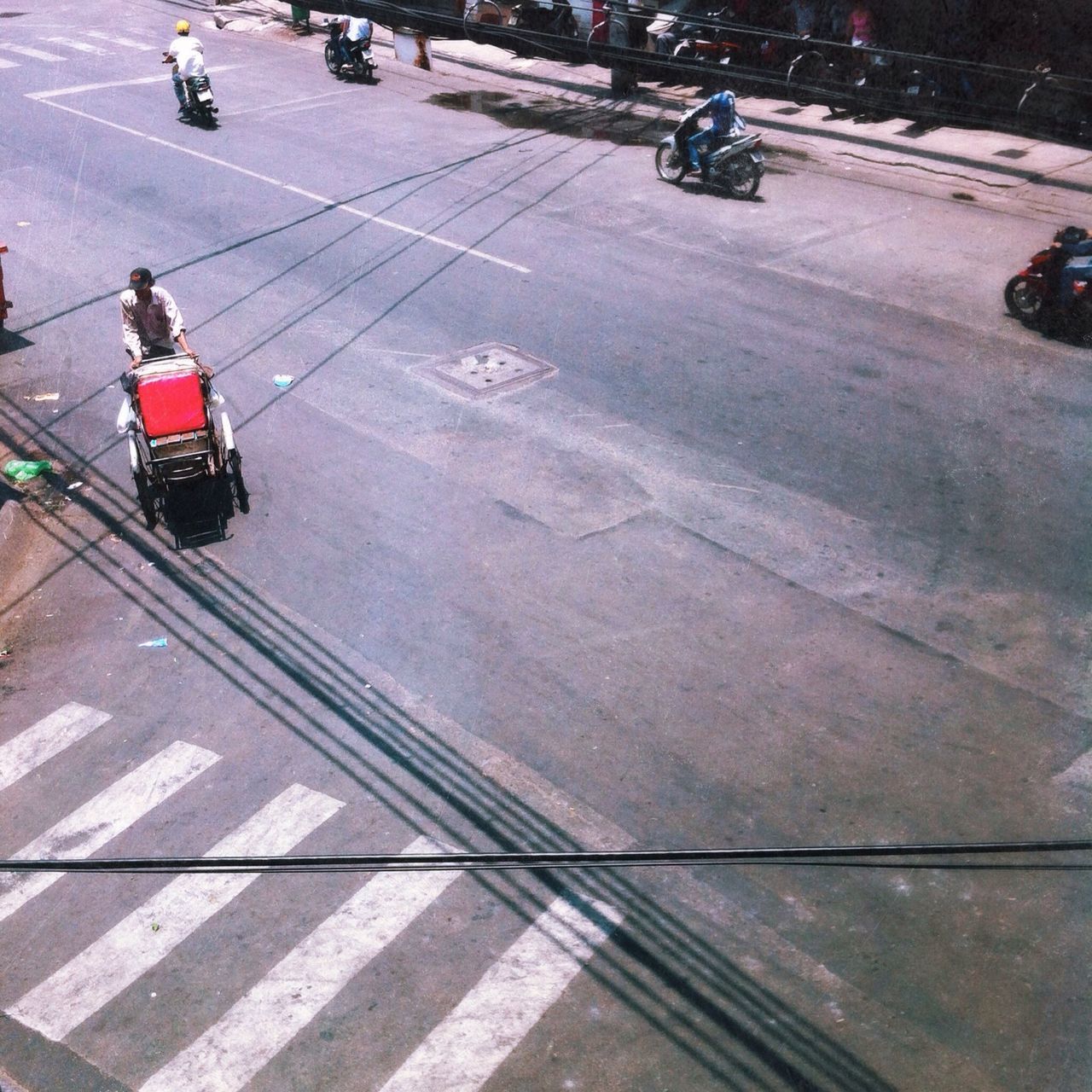 transportation, mode of transport, street, land vehicle, road marking, men, lifestyles, road, city life, on the move, zebra crossing, high angle view, walking, person, city street, travel, car, leisure activity, city