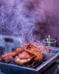 Close-up of meat on barbecue grill