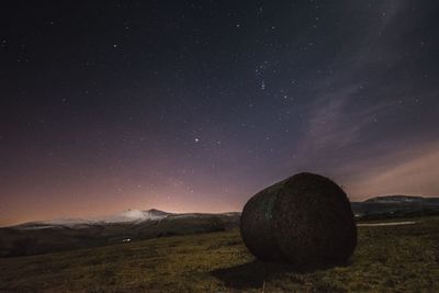 Scenic view of field against sky at night