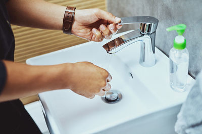 Cropped hands of person washing hand